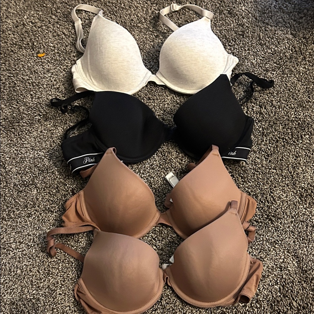 PINK Victoria's Secret Black, White, and Tan Bra Trio